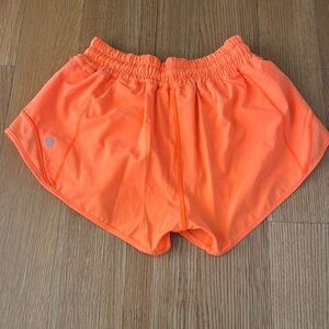Lululemon size 2 hotty hot shorts in bright orange, 2.5 inch